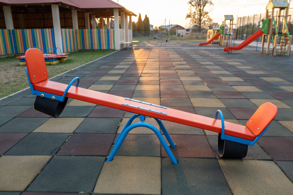 rubber coating and flip flap swing at the playground at preschool.